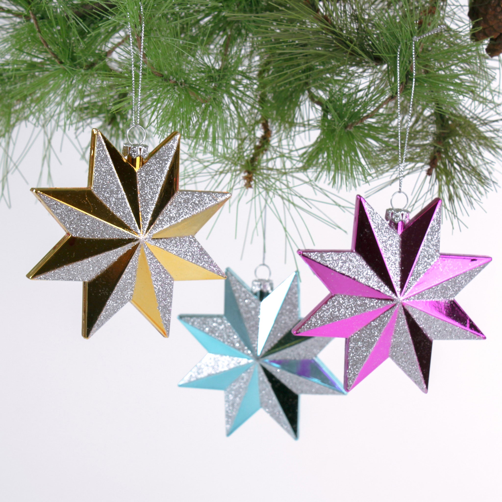 Set of three glittered star Christmas ornaments in assorted metallic colors