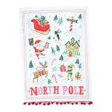 a christmas tea towel with festive motifs and text that reads North Pole in a white background