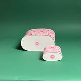Nutcracker Ribbon Christmas caddy bottom view in large and small on a green background