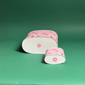 Nutcracker Ribbon Christmas caddy bottom view in large and small on a green background