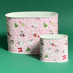 Empty duo of Nutcracker Ribbon Christmas caddies in large and small on a green background