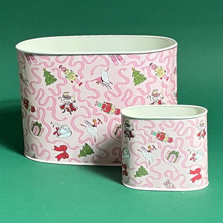 Empty duo of Nutcracker Ribbon Christmas caddies in large and small on a green background