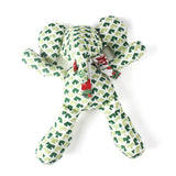 Green and white patterned stuffed elephant toy with a decorative bow.