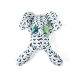 Blue and white patterned stuffed elephant toy with a green bow.