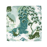 Old Peking style dinner napkin in green and blue tones featuring a scenic landscape pattern with trees and nature details, neatly finished fabric designed for elegant table settings