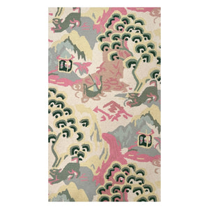 A yellow pink and green rug in a chinoiserie pattern