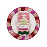 a pagoda designed place card on top of a napkin cloth, plate and rattan placemat