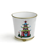 White tole cachepot with hand-painted festive pagoda design and gold trim, standing upright.