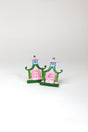 a pair of metal Pink and green chinoiserie napkin rings in the shape of pagodas from Madcap Cottage. 