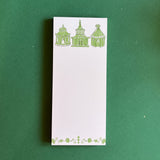 Pagodas Skinny Notepad in green featuring illustrated pagoda designs and floral border in a green background