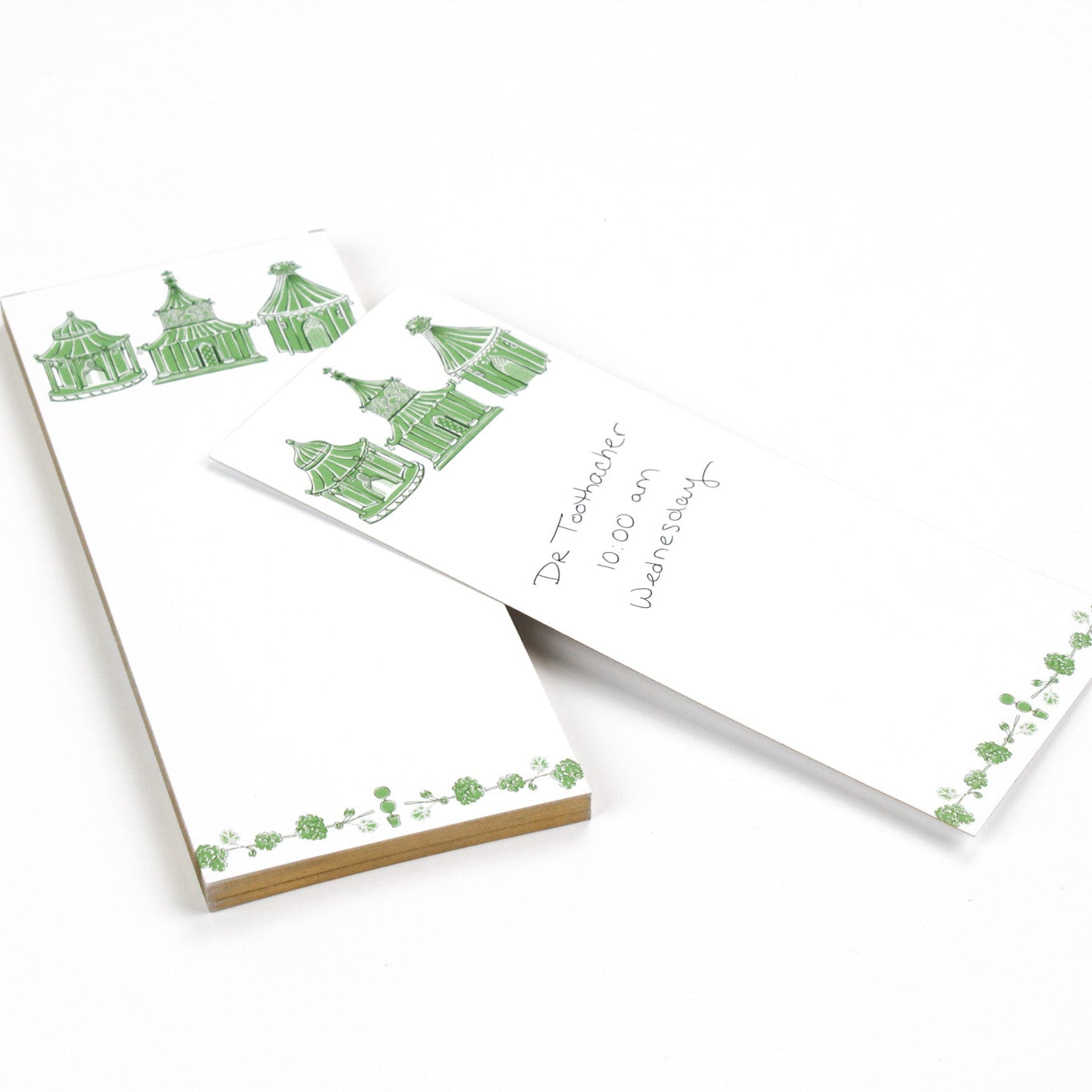 Pagodas Skinny Notepad in green featuring illustrated pagoda designs and floral border in a white background
