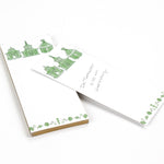 Pagodas Skinny Notepad in green featuring illustrated pagoda designs and floral border in a white background
