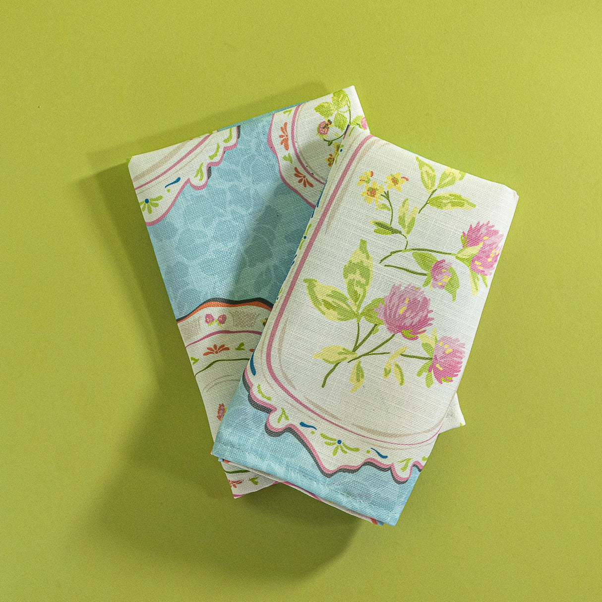 A pair of blue vintage plates fabric spring napkins