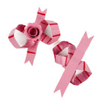 pair of pink striped bow-shaped candleholders without candles