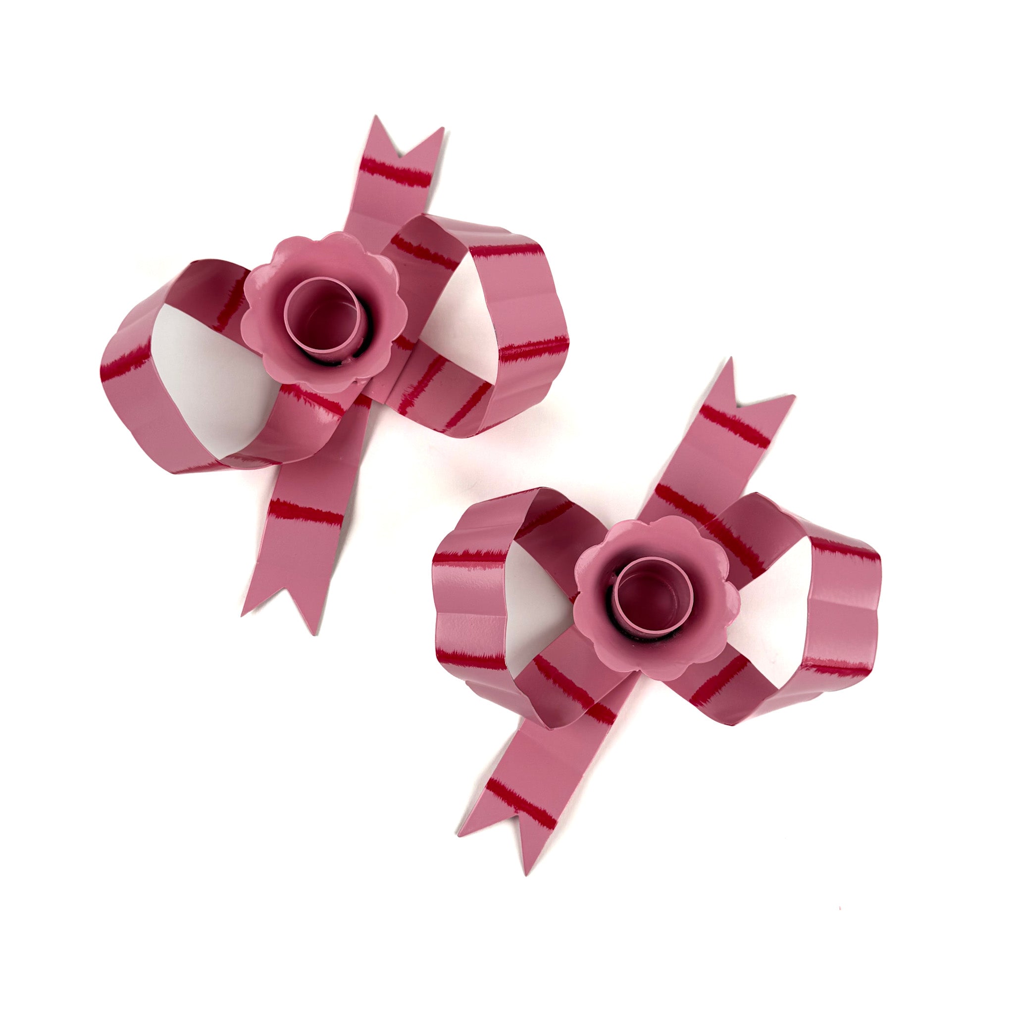 pair of pink striped bow-shaped candleholders