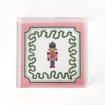 Nutcracker Square Acrylic Tray with in medium size with pink and green border and Nutcracker in the center.