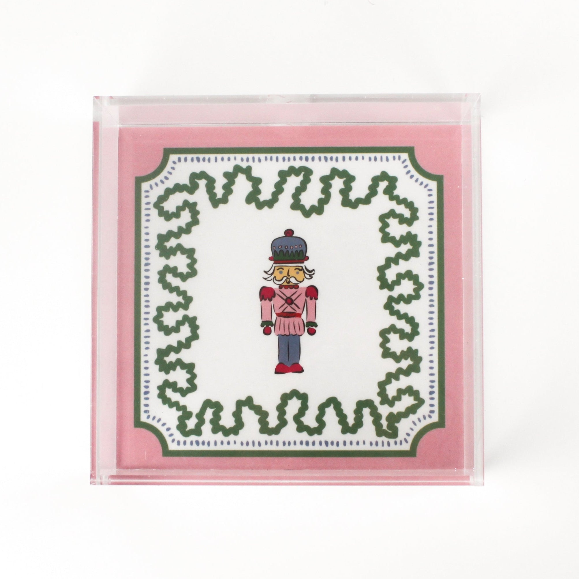 Nutcracker Square Acrylic Tray with in medium size with pink and green border and Nutcracker in the center.