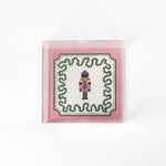 Nutcracker Square Acrylic Tray with in small size with pink and green border and Nutcracker in the center.