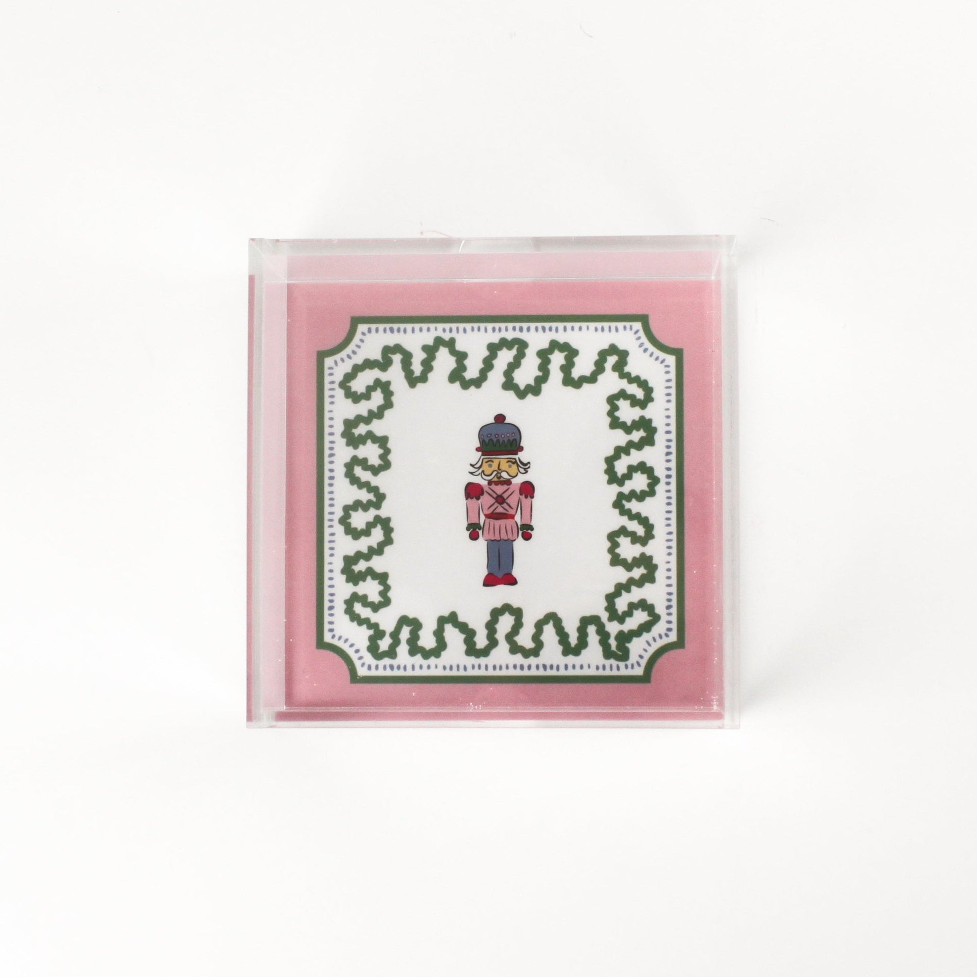 Nutcracker Square Acrylic Tray with in small size with pink and green border and Nutcracker in the center.