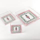 Nutcracker Square Acrylic Tray with in 3 sizes with pink and green border and Nutcracker in the center.