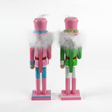 back view of two Pink and Green Christmas Nutcracker Table Decorations against a white background. 