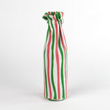 pink, green, and white striped fabric wine bag standing upright