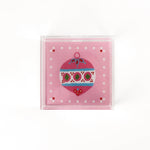 a small pink square Acrylic Trays with Ornament motif on it on a white background