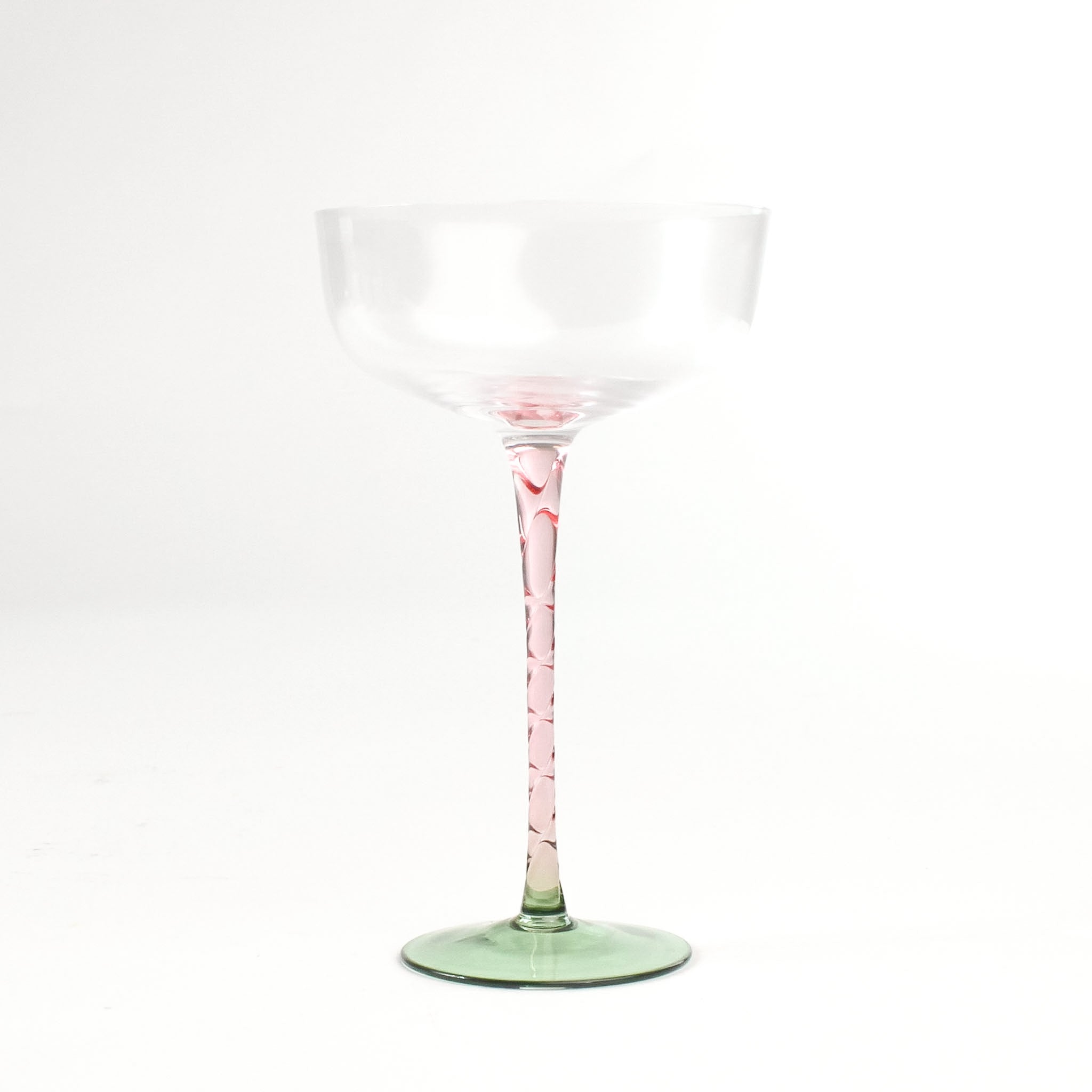 an elegant pink Stem Coupe Glass with a green bottom in white background