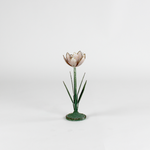 a large metal flower candle holder in the shape of a pink lily on a white background