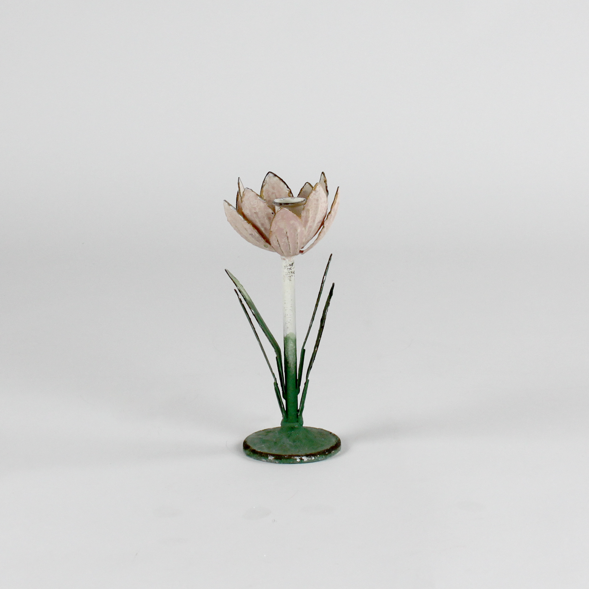 a small metal flower candle holder in the shape of a pink tulip on a white background