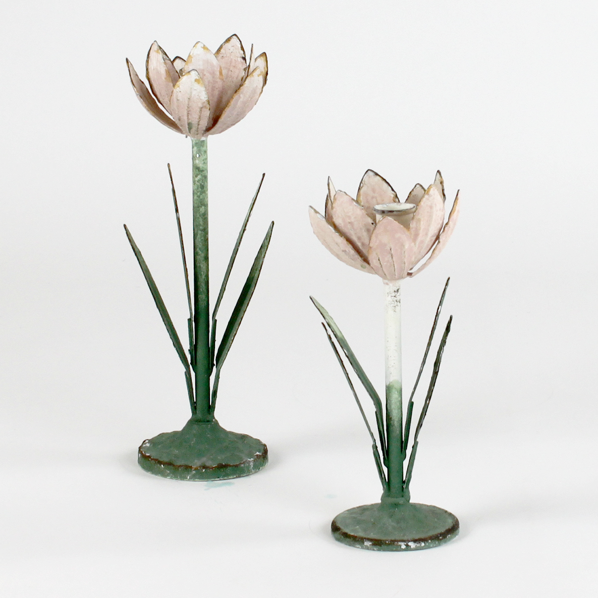 Two decorative metal Pink Tulip flower sculptures on a white background