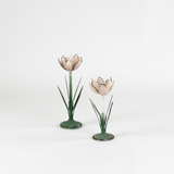 Two decorative metal Pink Tulip flower sculptures on a white background