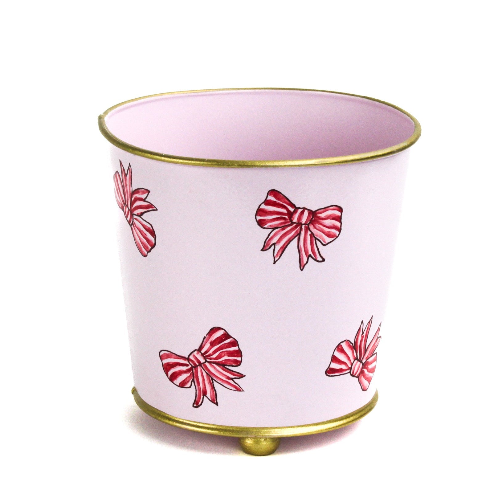 Pink tole cachepot with hand-painted red striped bows and gold trim, standing upright.