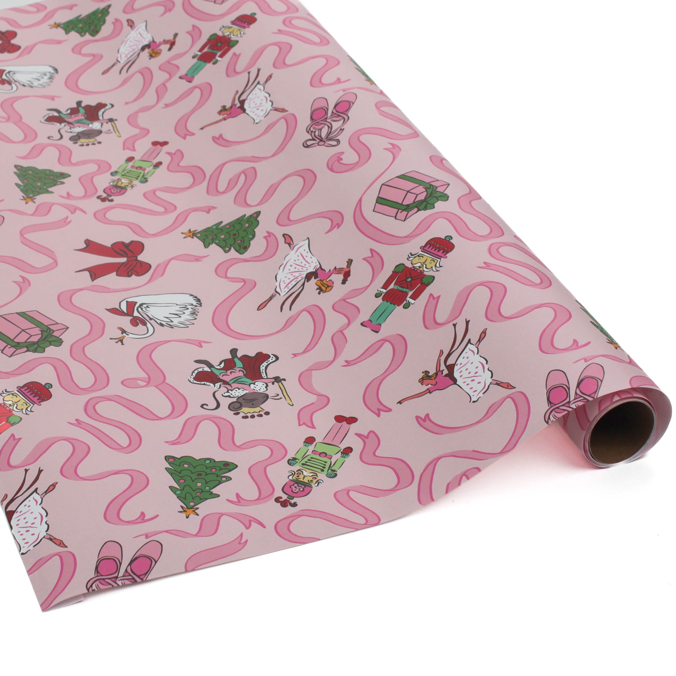 Pink Christmas wrapping paper featuring nutcracker and ribbon motifs.