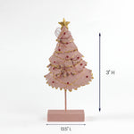 Pink tabletop Christmas tree decor with gold trim and red accents on a base, measuring 13.5 inches long and 3 inches high.