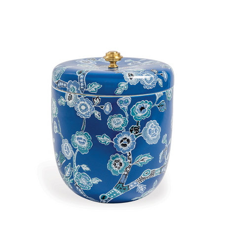 a blue porcelain ice bucket covered in a cherry blossom pattern with a brass finial on the lid. 