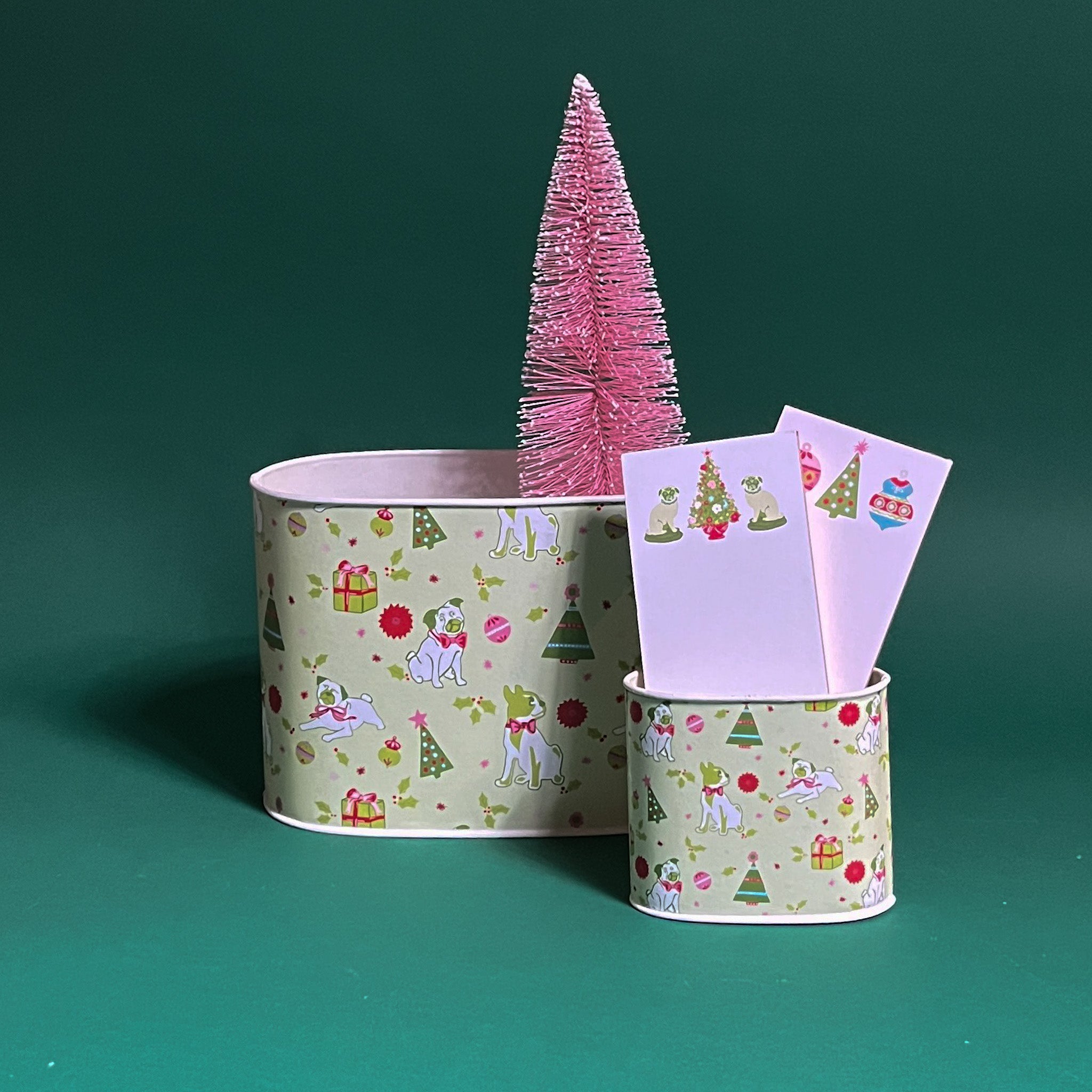 Pug Perfection Christmas caddy filled duo in large and small on a green background
