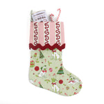A green Christmas stocking with pug motifs and a pink striped top