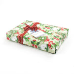 Gift wrapped in Pug gift wrapping paper with red ribbon.