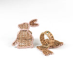 2 set of Rattan bunny napkin rings on a white background, one showing the front and the other is showing the back
