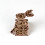 Rattan bunny napkin rings on a white background