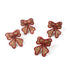 Set of four red-trimmed rattan bow napkin rings arranged on a white background.
