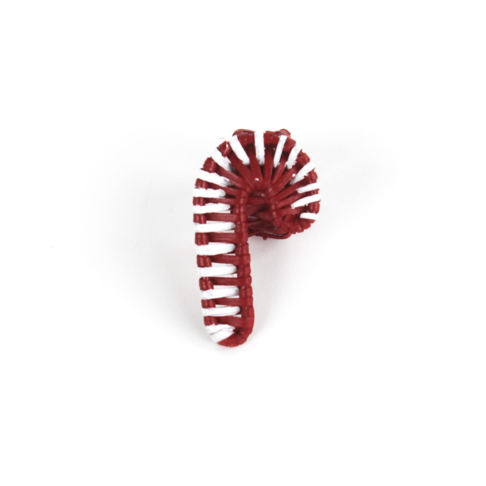 rattan white and red candy cane christmas napkin rings against a white backgroud. 