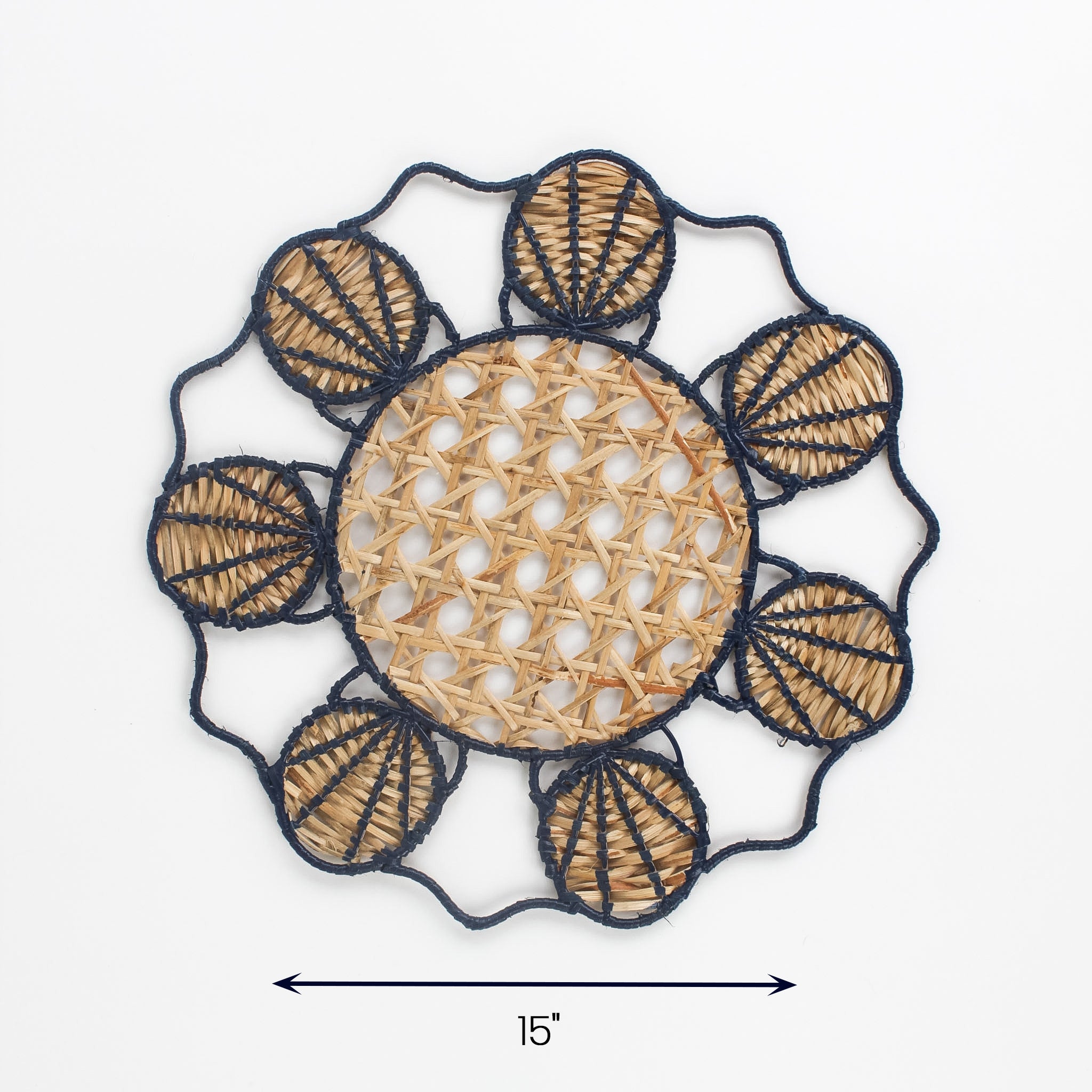 Round rattan placemat with blue shell design and natural woven center, 15 inch diameter