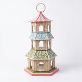A three tiered rattan pagod with hand painted metal rooves in pastel colours. 