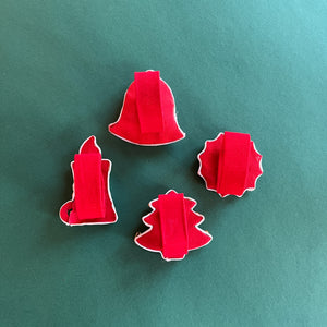 Rear view of Vintage Satin Christmas-Icons Napkin Rings on a green background