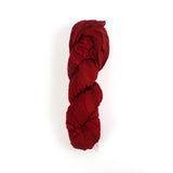 a recycled torn-silk ribbon in red laid in a white surface