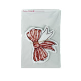 Pack of red bow–shaped paper place cards with hand-painted striped bow design, shown in clear packaging on a white background.
