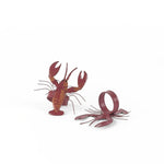 Pair of red lobster napkin rings featuring detailed coastal-inspired lobster design.