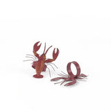 Pair of red lobster napkin rings featuring detailed coastal-inspired lobster design.